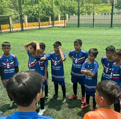A coach gives a team talk to our players at the Goa Football Festival. Competing in tournaments is a key part of our development program.