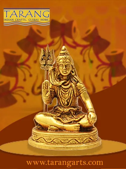 This brass statue depicts Lord Shiva in a seated meditative pose, holding his Trishula (trident). It is a classic representation of the deity as the ultimate ascetic, perfect for creating a space of calm and spiritual focus.