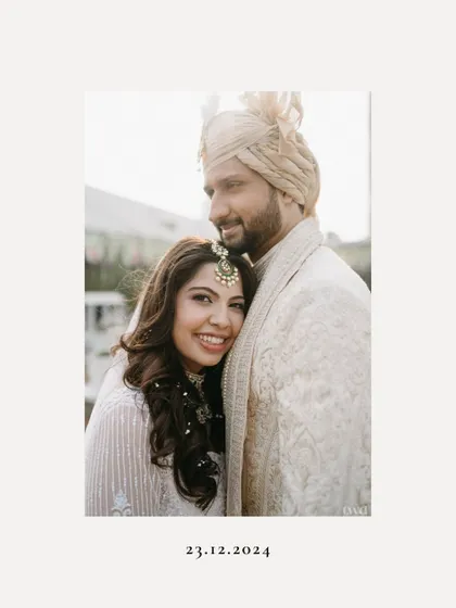 A simple, elegant, and heartfelt portrait. The bride rests her head on the groom's shoulder, a picture of love, trust, and contentment.