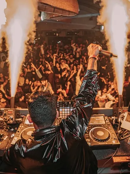 A view from behind the console as I command the stage. The combination of my music, the visuals, and the pyro creates a powerful, unified experience.