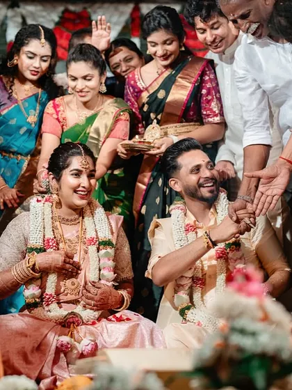 A candid shot of a couple surrounded by family during their wedding ceremony. We capture the joy and involvement of all your loved ones.