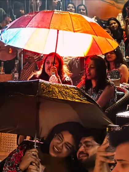 Not even a little rain can stop our vibe. The umbrellas came out and the singing continued with even more josh.