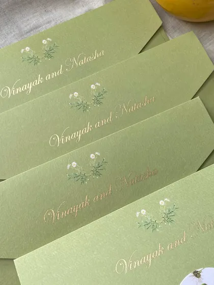For this cross-cultural wedding in the UK, I designed these elegant sage green envelopes with the couple's names in gold foil. The design inside was a beautiful fusion of Indian and British elements.