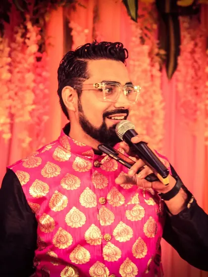 A candid shot from a sangeet night. You can see the beautiful floral decor in the background, which added to the festive atmosphere. My pink jacket was a perfect match for the vibe.