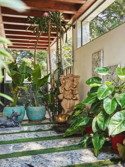 This cozy corner shows how my terracotta planters can complement other decor elements, like this beautiful Ganesha statue, to create a tranquil, green sanctuary.