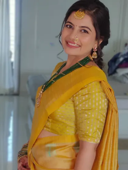 A happy, smiling shot of Nidhi, proving that cross-cultural looks can be so much fun.