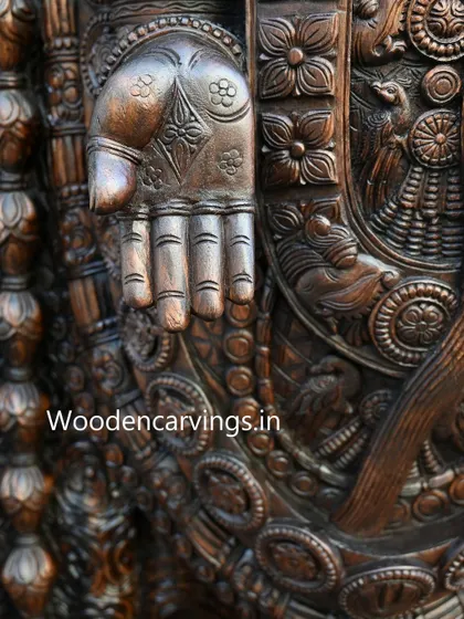 The hand of the 79-inch Lord Venkatajalapathy, held in the Varada mudra (gesture of giving boons), showcases the delicate floral patterns and anatomical precision our artisans achieve.
