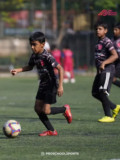 A player dribbles forward with speed and focus during a competitive match.
