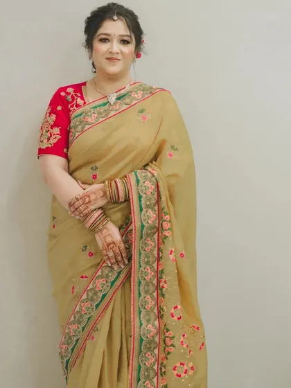 A full-length view showing the complete look. The makeup and hairstyle are designed to be sophisticated and age-appropriate.