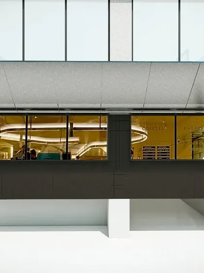 The facade render, showing how the design creates a distinct and modern identity for the cafe.