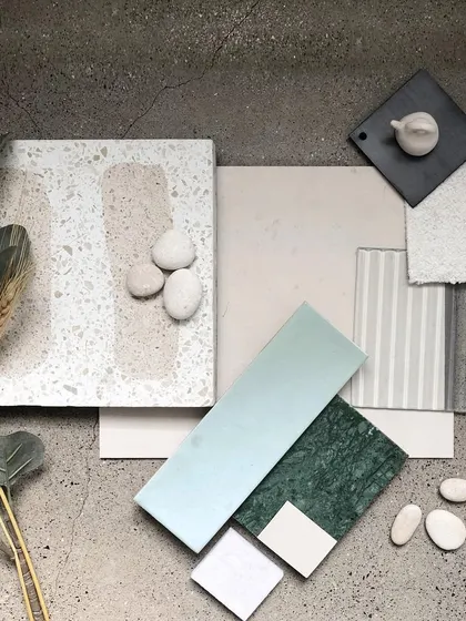 A material palette we developed for a clinic project named 'Crème'. This flat-lay shows our process of curating textures and colors, blending terrazzo, marble, and soft fabrics to create a soothing and earthy aesthetic.
