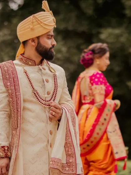 A beautiful shot of the bride and groom. Her elegant updo is the perfect complement to her traditional wedding attire.