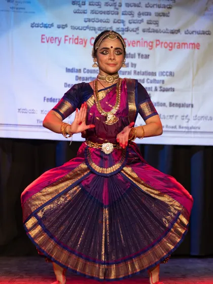 I am so proud to see my senior students command the stage. Here is my disciple Vidushi Anushree Bhat in a classic Bharatanatyam pose during her solo recital for the Indian Council for Cultural Relations (ICCR), showing the grace we nurture for solo and duet performances.