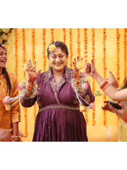 The bride's joyful reaction during her Haldi ceremony. We focus on capturing genuine emotions and expressions.