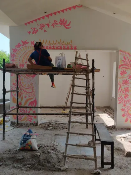 Taking a moment to plan my next move on the 'Baba's Garden' mural. Each section is sketched out in my mind before I apply the paint, allowing the design to flow organically across the walls.