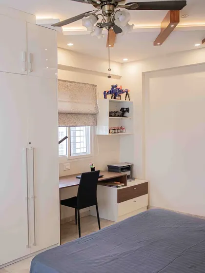 Another view of the multifunctional bedroom unit, showing how the wardrobe, shelves, and desk are seamlessly combined. This is a great solution for compact rooms or for creating a dedicated work-from-home space.