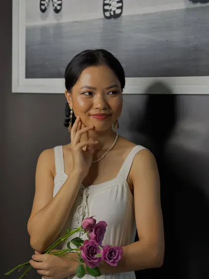 A smiling shot that shows how a soft makeup look can enhance natural beauty, making it perfect for daytime events, photoshoots, or as a subtle bridal option.