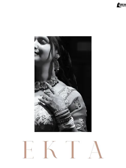A minimalist black and white portrait of Ekta, focusing on her profile and the delicate details of her Mehndi attire.