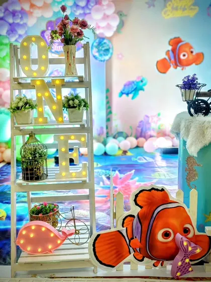 A close-up of the 'ONE' shelf and Nemo character cutouts.
