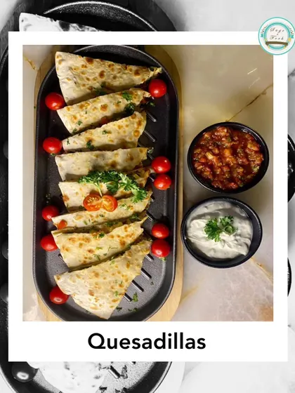 Our vegetable quesadilla is loaded with onions, bell peppers, zucchini, and lots of cheese. Served with salsa and sour cream, it's a great appetizer or main.
