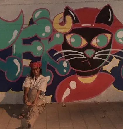 Me sitting proudly with my finished 'Vrek13' cat graffiti. This piece has my signature style all over it.