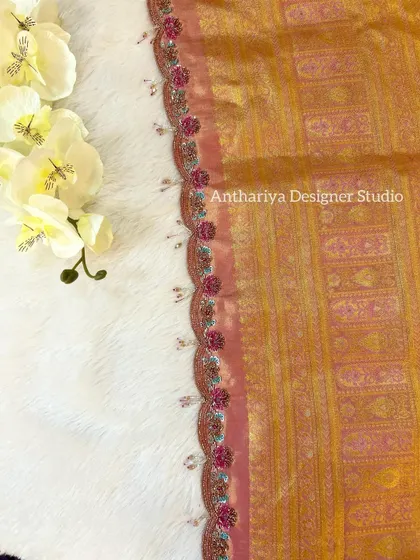 A close-up of the delicate beaded tassels on the matching saree.