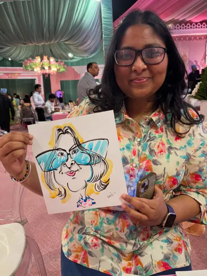 The big, bold glasses are the highlight of this fun caricature, and the guest's smile shows it's a hit.