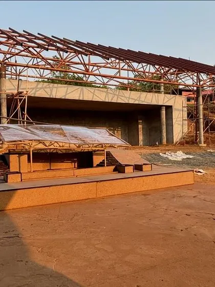 The physical model was an essential tool for communicating the complex 50-foot span steel truss design for the yoga retreat's main stage.
