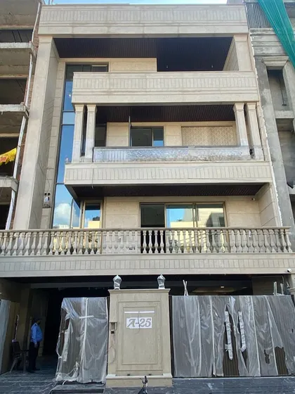 The actual building during the final stages of construction. This image shows how the structural and decorative elements from the 3D model have been brought to life.