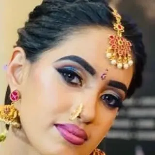 A close-up of a classic bridal eye makeup. The blend of blue and black eyeshadow with a sharp wing liner creates a captivating look that is perfect for evening events.