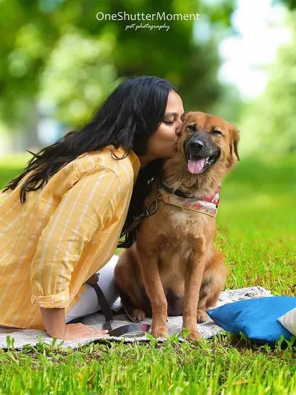 A sweet kiss for a happy rescue dog. Capturing moments like this, where you can see the incredible bond and transformation of a rescue pet, is why I love what I do.
