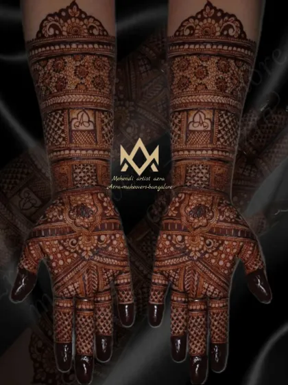 A dark and dramatic shot of a traditional bridal mehendi design.