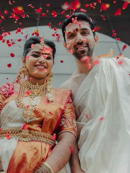 A celebratory moment for the newlyweds. Sahana's makeup remained flawless and radiant throughout the long ceremony, ensuring she looked perfect in every shot.