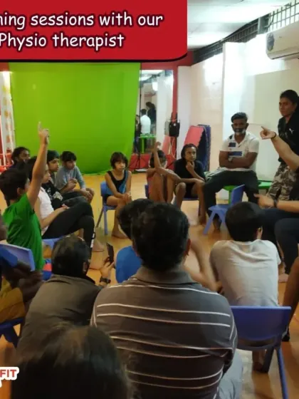 Holistic athlete development is key. Here, our gymnasts participate in a learning session with our physiotherapist, focusing on injury prevention and understanding their bodies better.