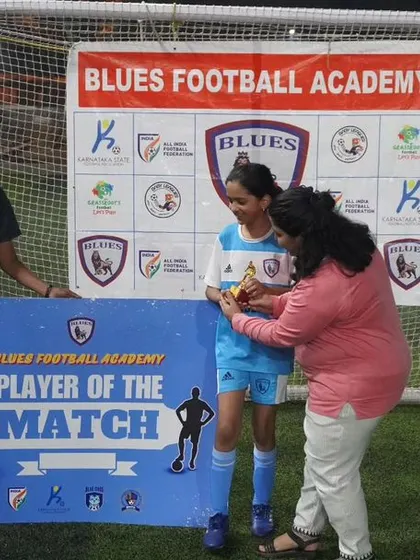 A player from our women's team is awarded "Player of the Match." I believe in highlighting individual contributions to the team's success.