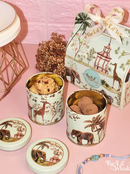 Another view of our Rakhi gift box, featuring tins of almond cookies and chocolate truffles. The matching Rakhi completes this thoughtful and delicious festive present.