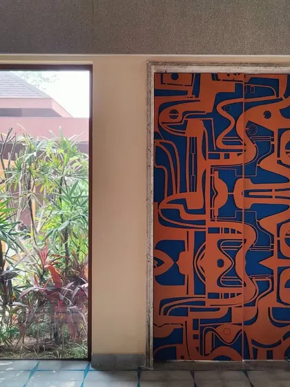 A straight-on shot of the door installed within the home's frame, highlighting its precise fit and its role as a functional architectural element that completely transforms the character of the space.