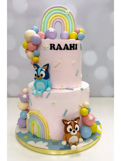 I love making kids' parties extra special. This two-tier Bluey cake features hand-modelled characters and colorful details, all made with tasty cream frosting that children actually enjoy eating.
