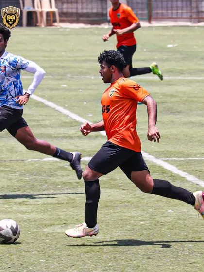 A player running at full pace with the ball, driving the team forward on a counter-attack.