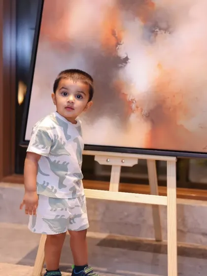 Even our youngest fans enjoy the art. A small child looks in wonder at a fiery abstract piece from 'Mystic Mirage'.
