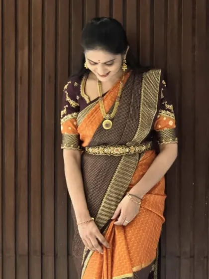 A candid moment of our client looking graceful in her Dhavala saree. It's wonderful to see my creations become a part of your special moments.