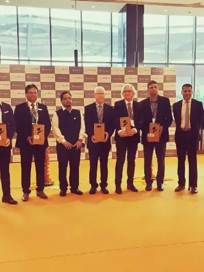 A group photo of the esteemed panel at the inauguration, ready to open the show for business.