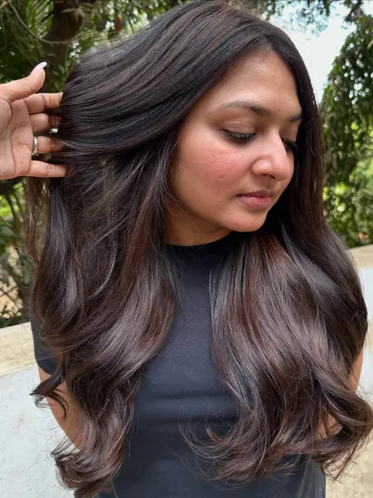 A portrait of the client with her new 'Cocoa Bean' hair.