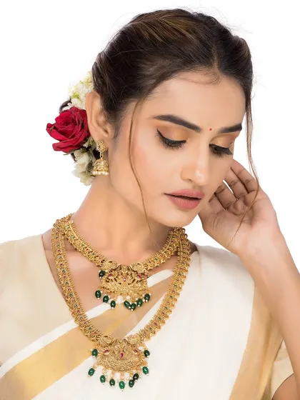 A more demure pose showcasing the same South Indian jewellery set, providing an alternative mood for the brand's lookbook.