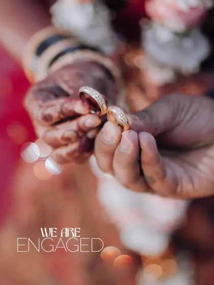 "We are Engaged!" A close-up shot of the couple's hands showing off their engagement rings. It's the little details that tell the big story.