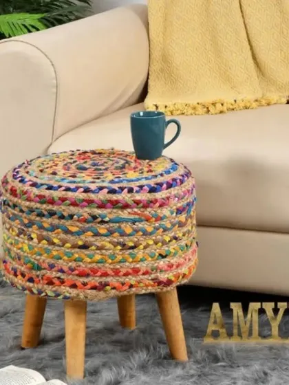 A vibrant, multi-colored jute stool that adds a playful and eclectic touch to your decor. Each piece is unique and full of character.