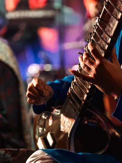 A moment captured during a live performance. The connection between the artist, the instrument, and the music is a sacred space.
