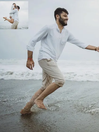 A candid moment of the groom running along the shoreline, part of the narrative of their fun-filled day in Goa.