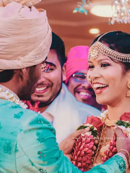 This is the moment I live for. The pure, unscripted joy during a South Indian wedding ceremony as the couple shares a laugh, surrounded by the happy faces of their loved ones.