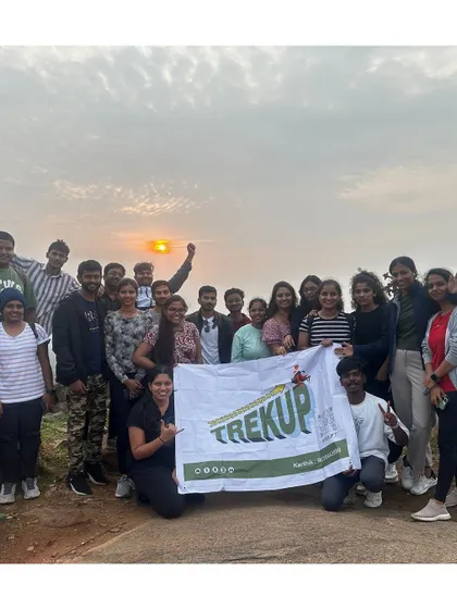 The whole group together at Huthridurga, with the sunrise creating a perfect backdrop. These are the memories we create every weekend.